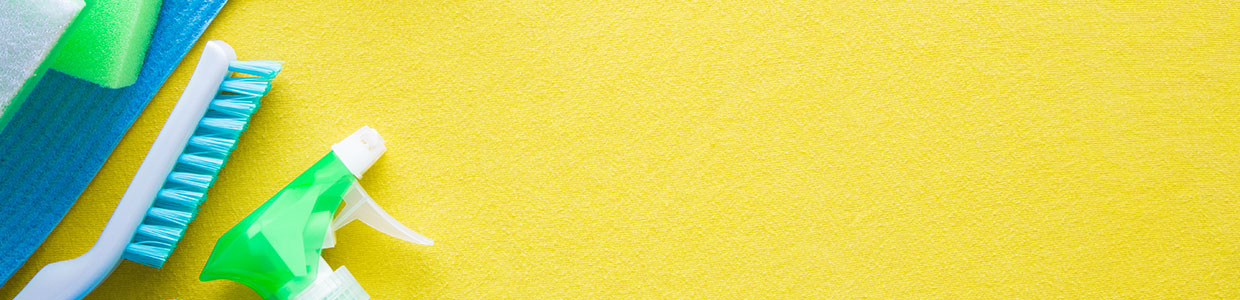 A yellow background with some green and white spots